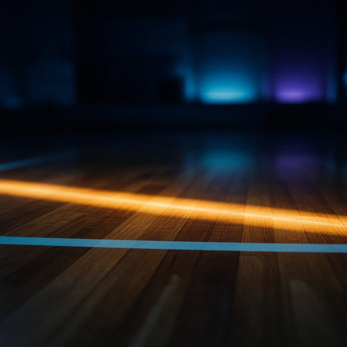 A low sideline view where court light crosses an open lane
